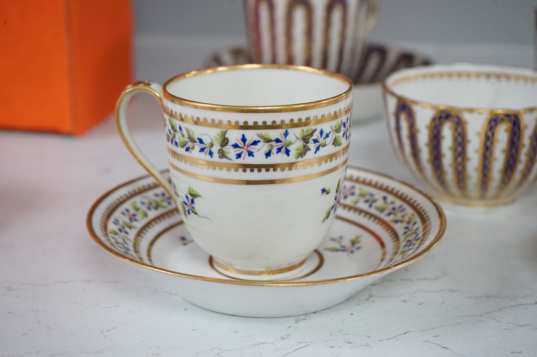 Two late 18th century Derby cornflower pattern coffee cups and saucers and Derby tea and coffee wares, largest 13cm in diameter